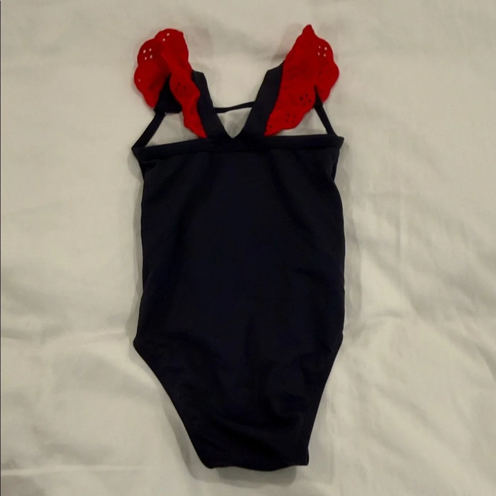 The Beaufort Bonnet Company Navy One-Piece Swimsuit with Red Ruffle Straps